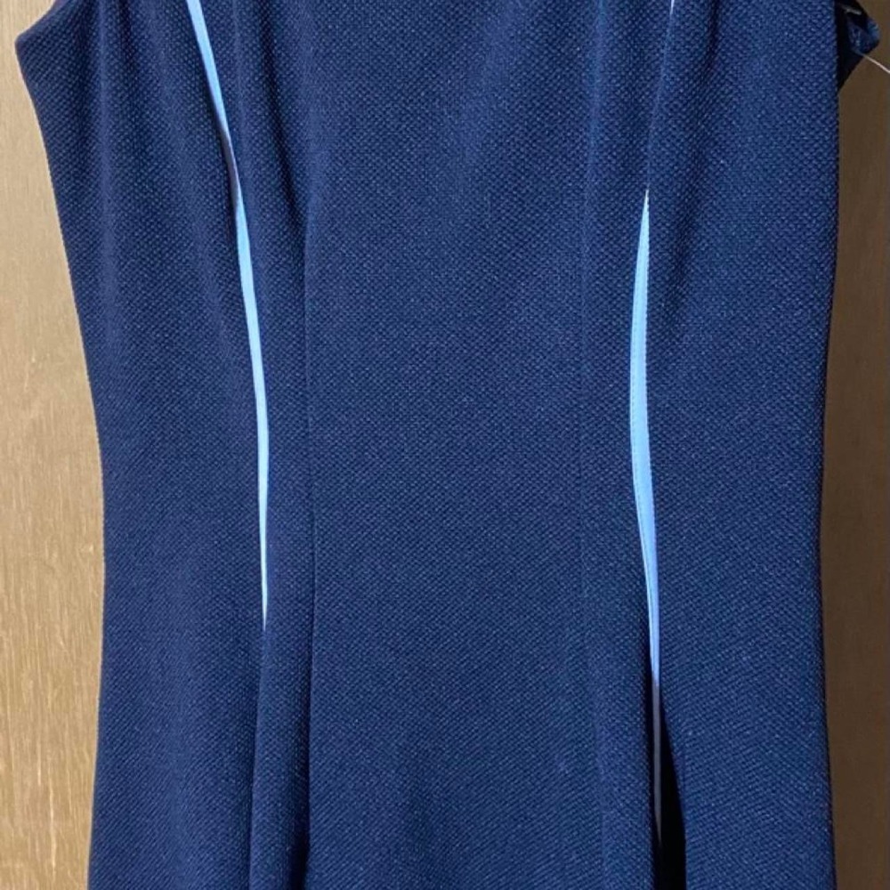 Navy blue long sleeve dress with cut out detail. Size: 4 Danny & Nicole